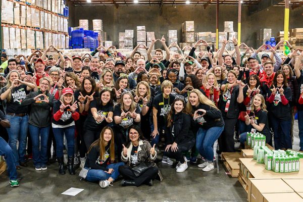 More than 100 volunteers from the University of Wisconsin-Madison and the University of Oregon are pictured at the Los Angeles Regional Food Bank