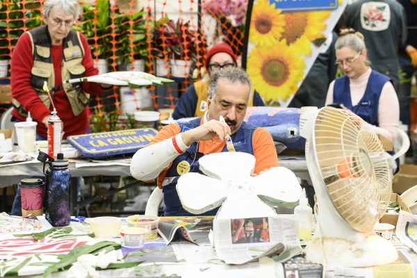 On Dec. 30, 2019, volunteers glue flowers and other natural materials to float elements that will be featured in the Tournament of Roses Parade in Pasadena, California on New Year's Day.