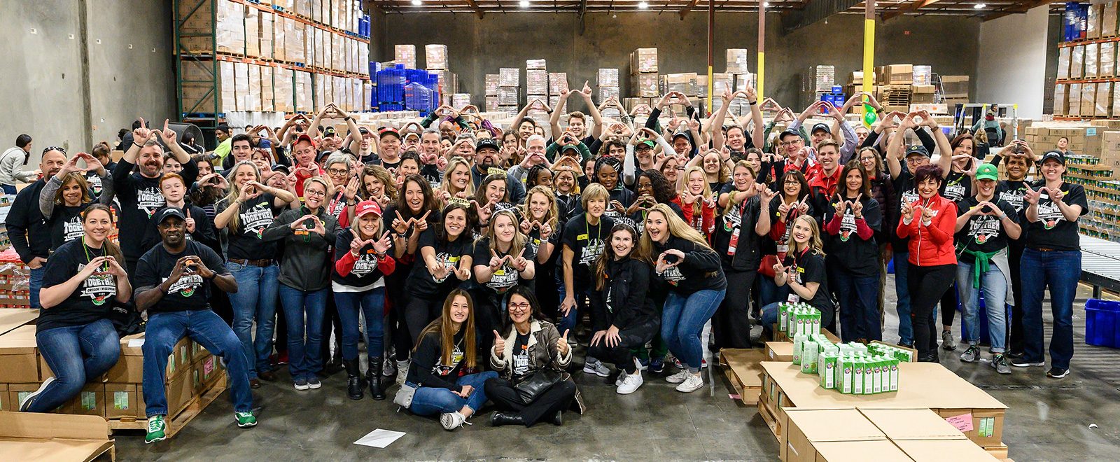 More than 100 volunteers from the University of Wisconsin-Madison and the University of Oregon are pictured at the Los Angeles Regional Food Bank