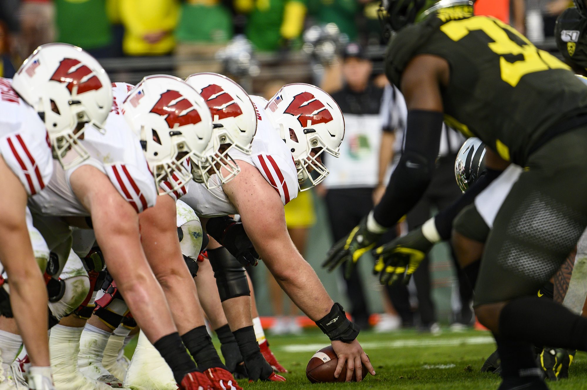 Members of offensive line prepare to snap the ball just before a touchdown late in the third quarter at the Rose Bowl Game in Pasadena, California on Jan. 1, 2020.